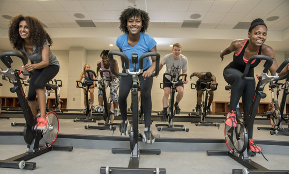 Students on exercise bikes at Kaplan Center.