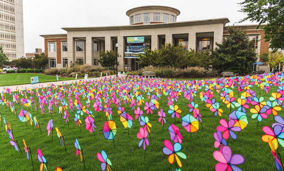 Photo of colorful pinwheels in front of the EUC.