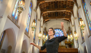Dr. Coelle conducts chorale ensemble in First Presbyterian Church