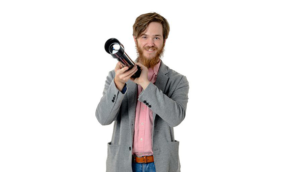 Photo of Aidan Lytle holding a telescope