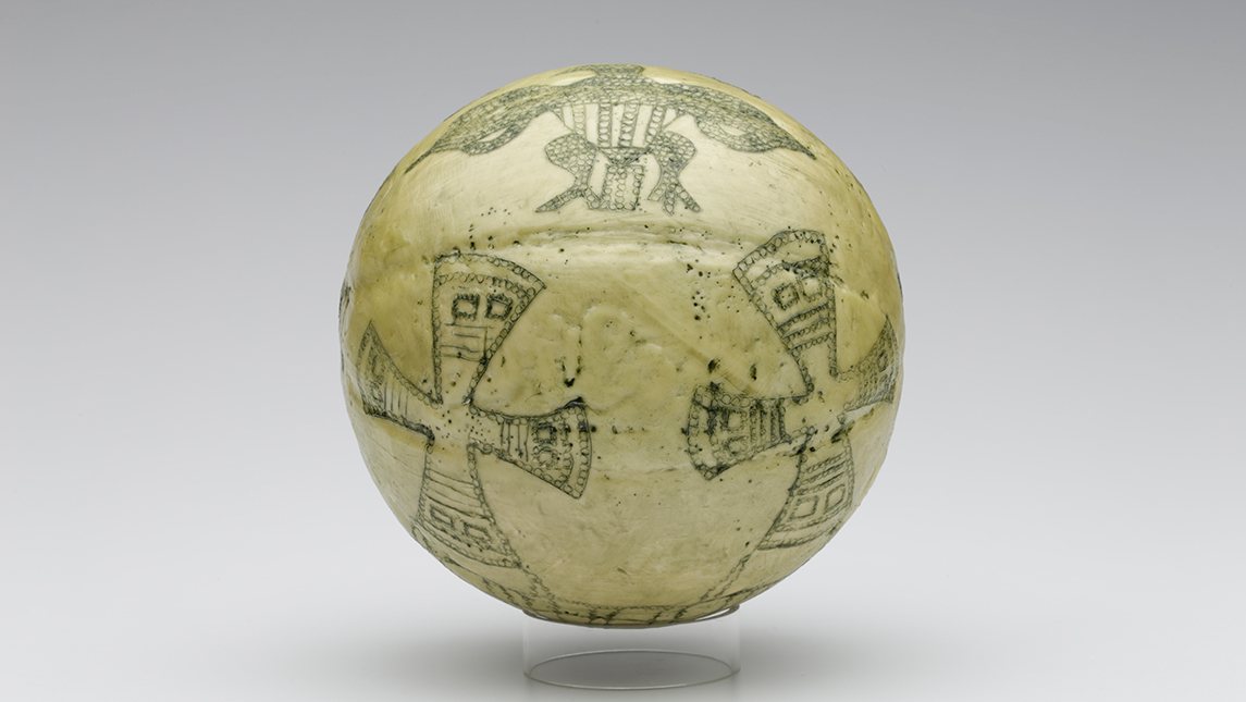 Photo of artwork that consists of a basketball that has been painted with different designs