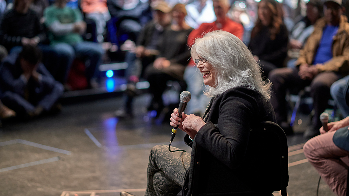 Emmylou Harris talking to room of people