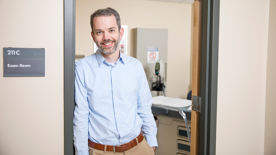 Dr. Andersen standing in the doorway of an exam room in a hospital