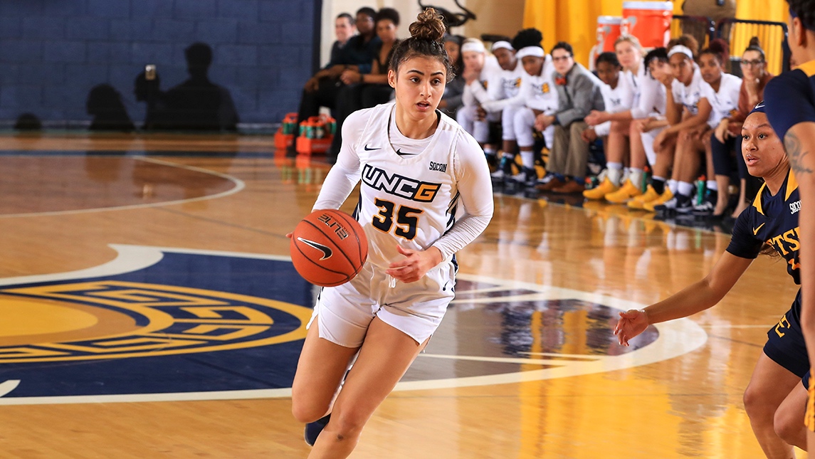 Basketball player dribbling the ball in a game