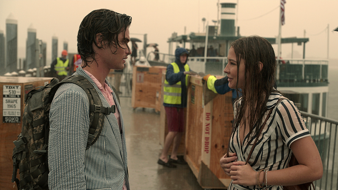 Production still from scene of John B. and Sarah in the rain