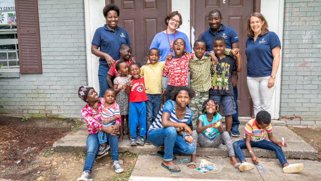 Volunteers with refugee family