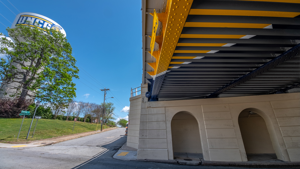 Railroad bridge with UNCG colors