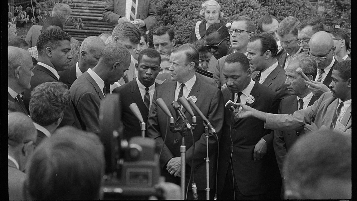 civil rights leaders speak with reporters