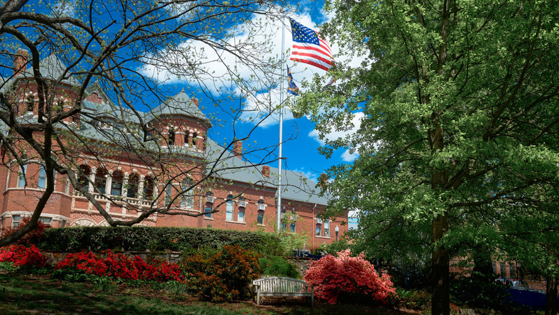 Campus building with American flag