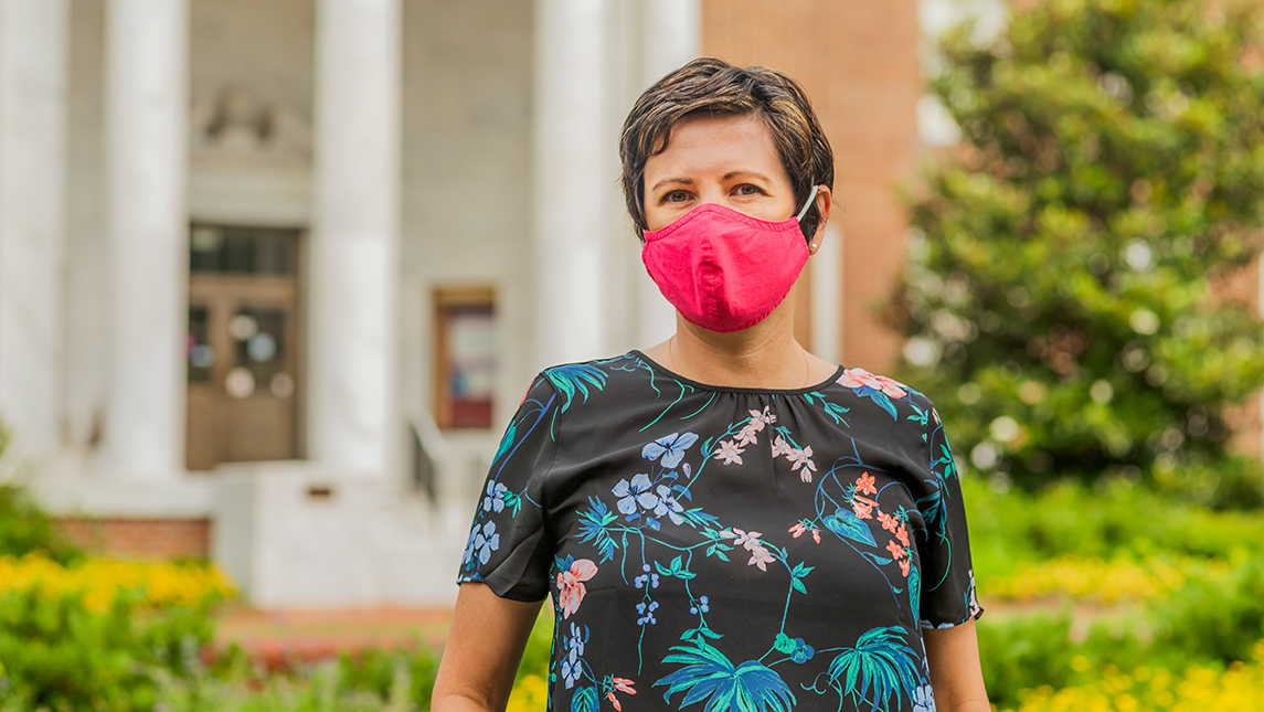 Portrait of Dr. Cassandra Workman wearing mask on campus