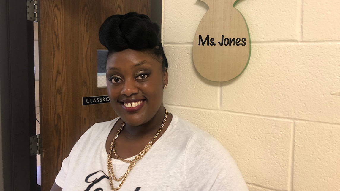 Ebonie Jones standing in front of her classroom