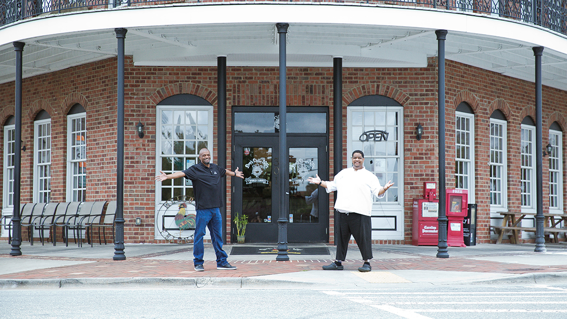 Dame Moore and Randy Wadsworth in front of Dame's Chicken & Waffles