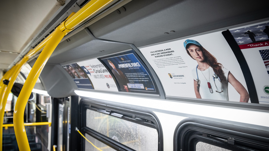 a bus interior with a poster