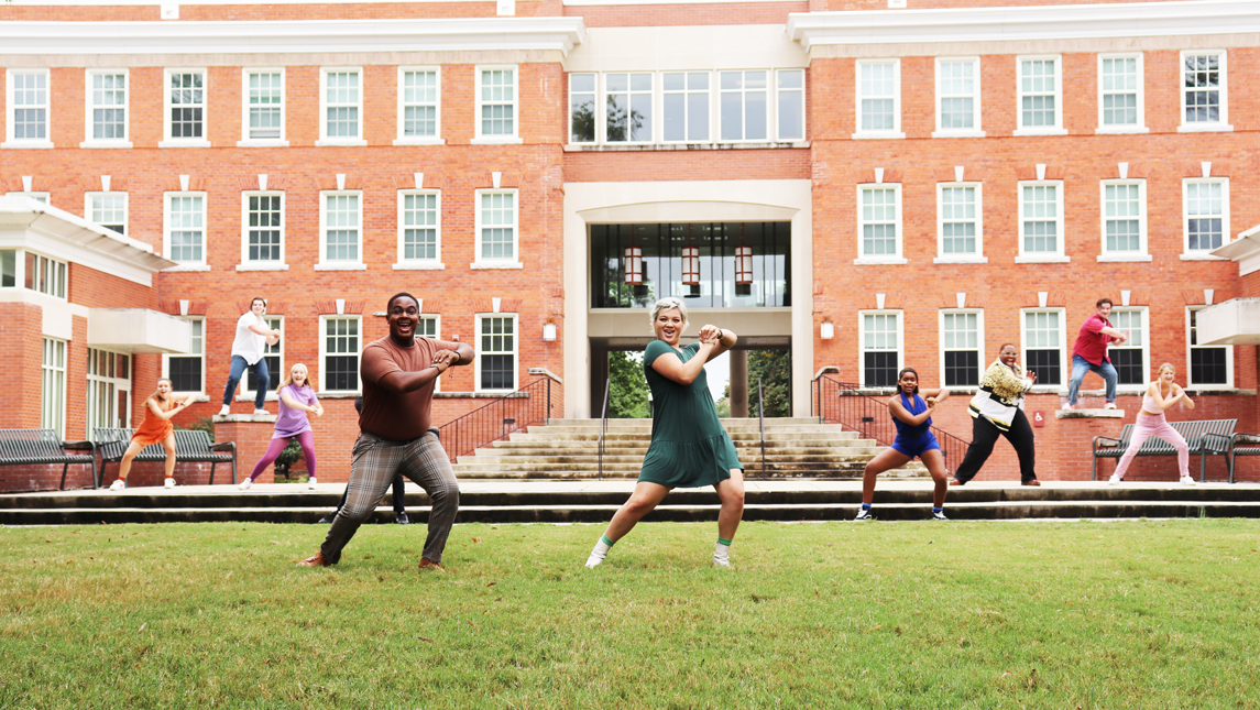 photo of musical theatre students performing on lawn