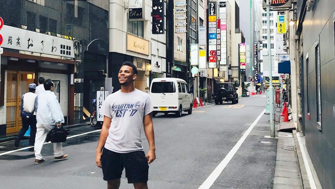 Photo of student standing on street in Japan