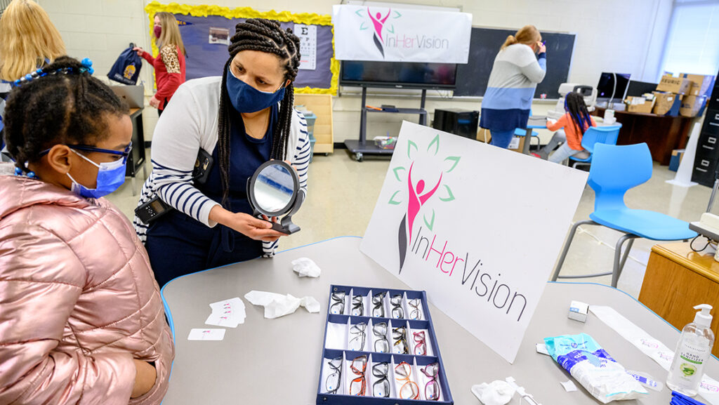 Student picks out glasses