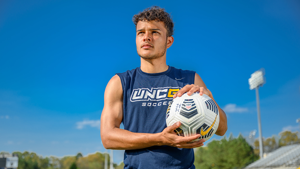 Photo of soccer player holding soccer ball