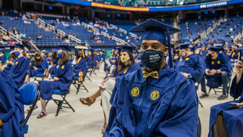 Student at commencement with mask on