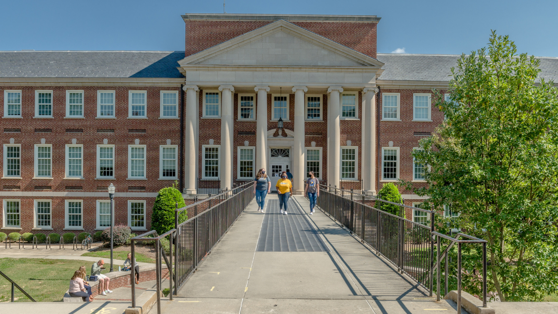 Students walking in front of Petty Building