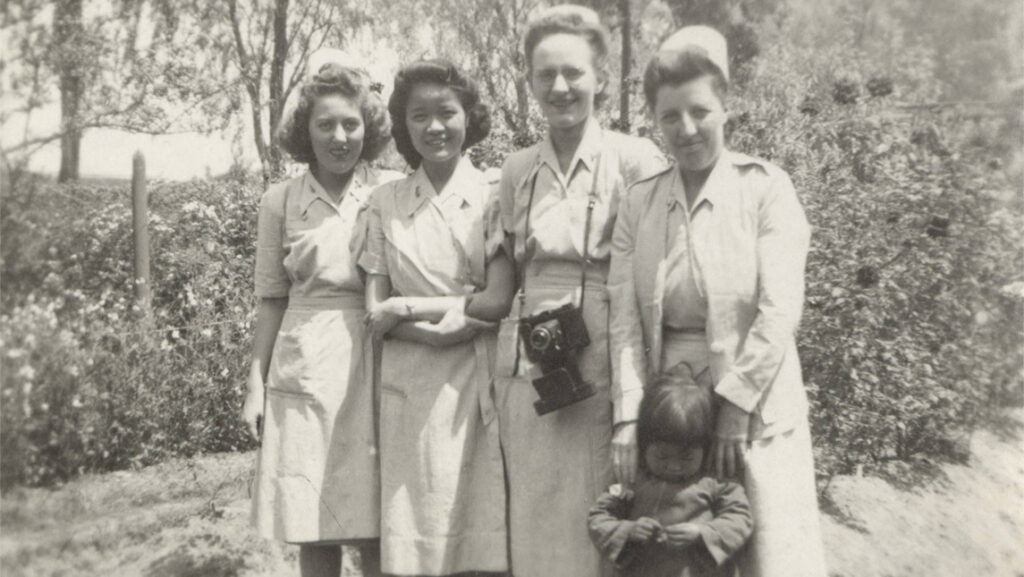 Archival black and white photo of women in nursing uniforms