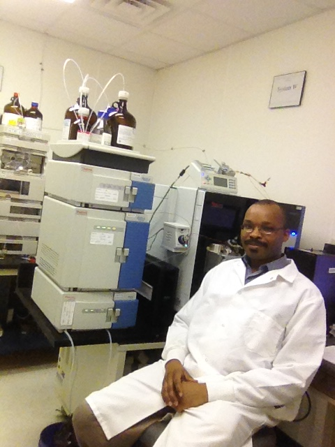 Dr. Dickson Wambua with science equipment
