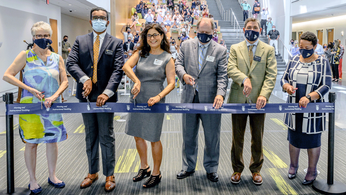 six people at ribbon-cutting
