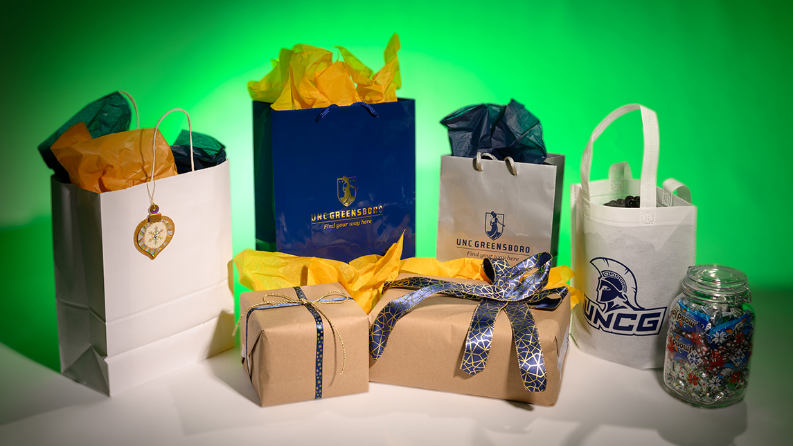 Blue and gold gifts with green background