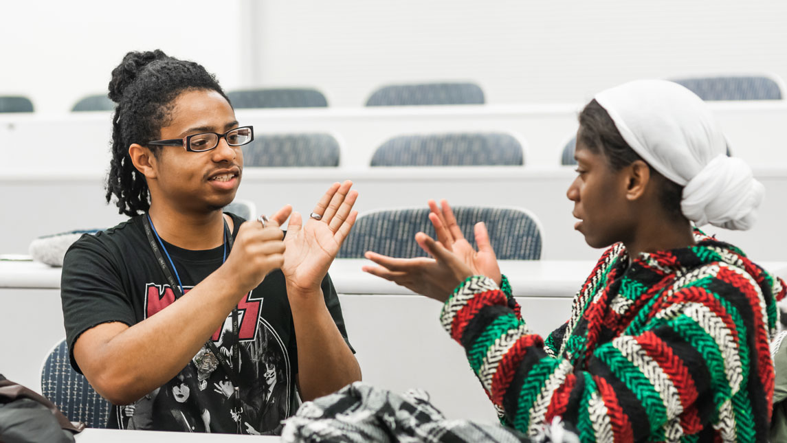 Students doing sign language