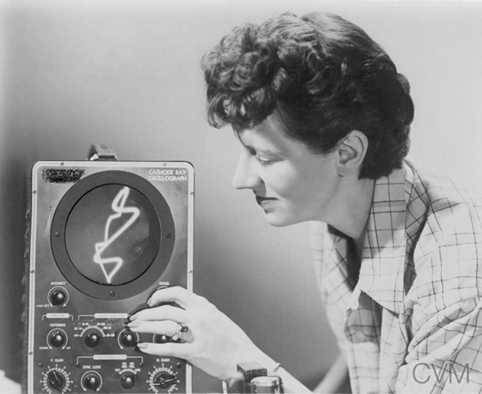 a woman with an old graphing machine