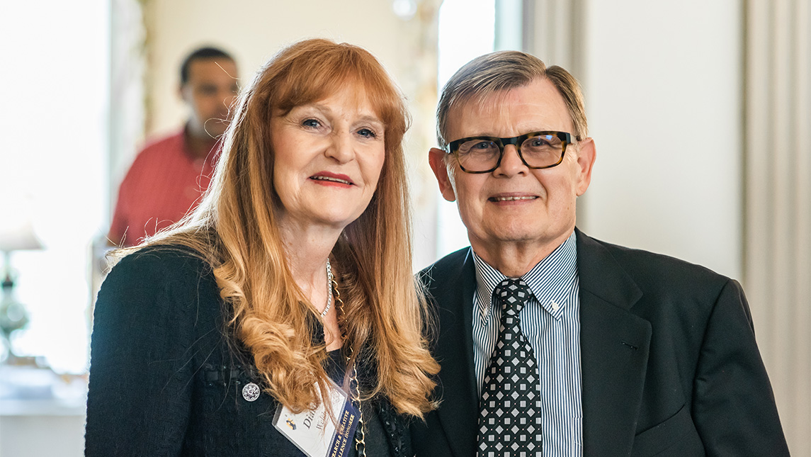 Dr. Welsh poses for photos at award ceremony in 2019