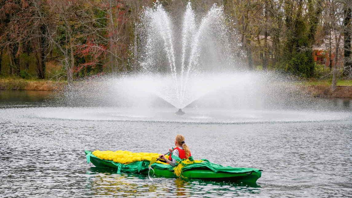 Student kayaking on Piney Lake