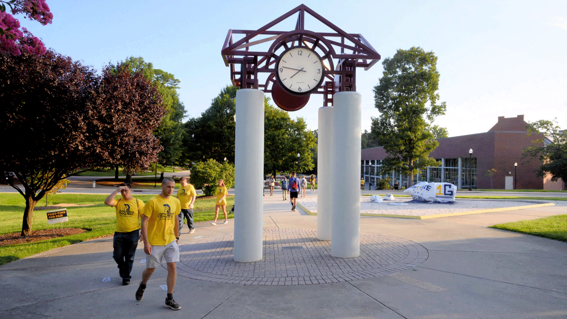 Students walking outside the clock tower
