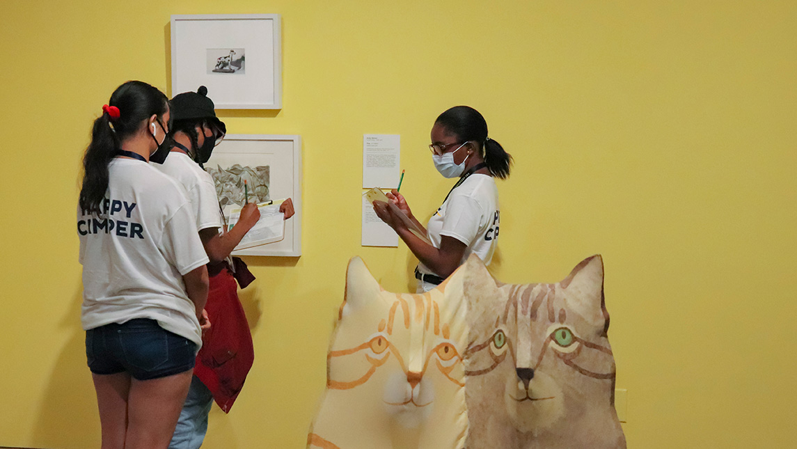 Intersection UNCG Campers looking at art work