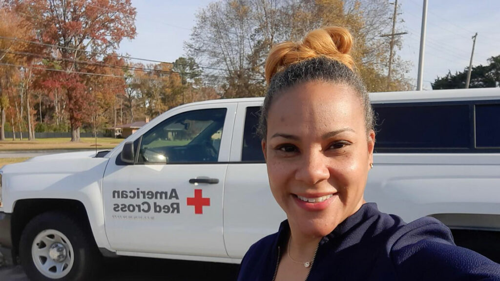 woman with Red Cross vehicle
