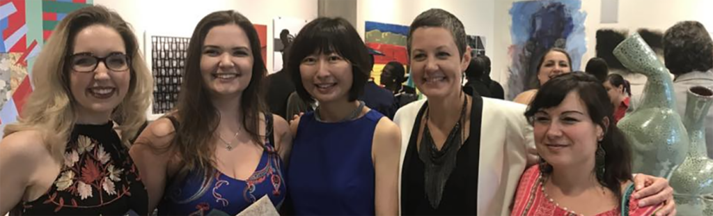 Three Art Education Graduates with Professors in Art Gallery