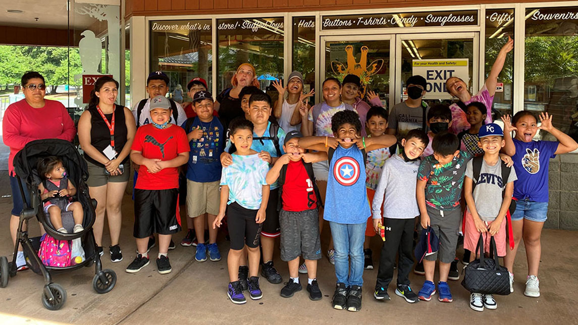 UNCG Student Volunteers with children at the Center for New North Carolinians