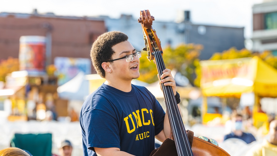 UNCG Student playing stand-up bass at music school