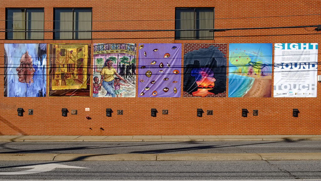 Industries of the Blind Building with art banners