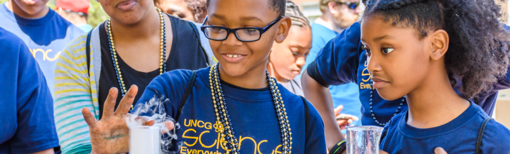 A young student experiments at UNCG’s annual Science Everywhere festival.