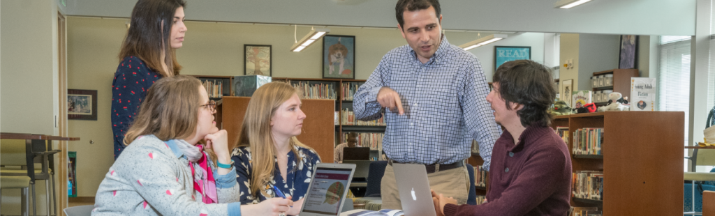 A group of Library Science students collaborate