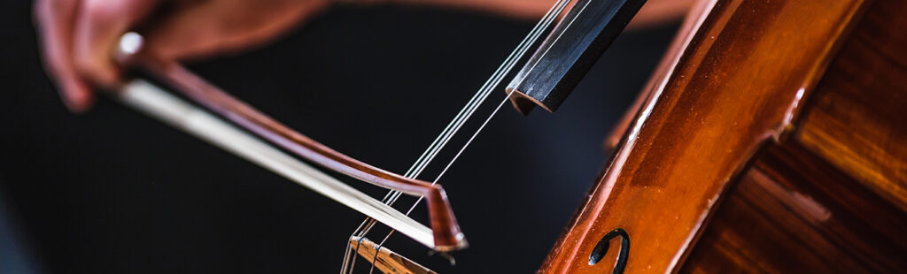 Closeup of a musician playing cello.