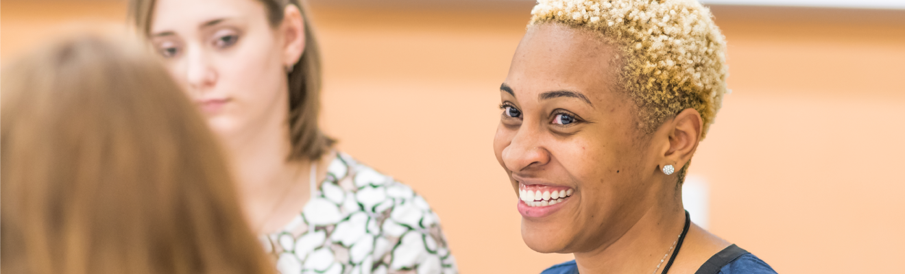 Students in a group discussion during the 2018 Triad Teacher Research Conference.