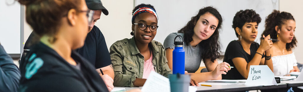 Six UNCG African American and African Diaspora Studies students sit at a classroom table