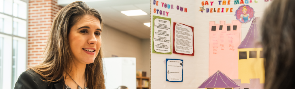 UNCG student teacher tutoring Hunter Elementary school student in reading