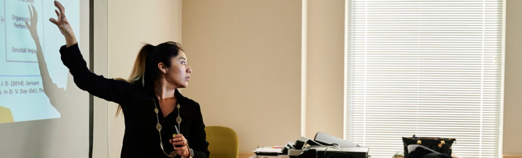 An instructor presents to her class