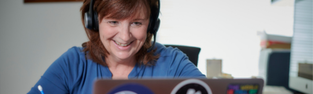 Instructor sitting focused on an eCoaching session on her computer.