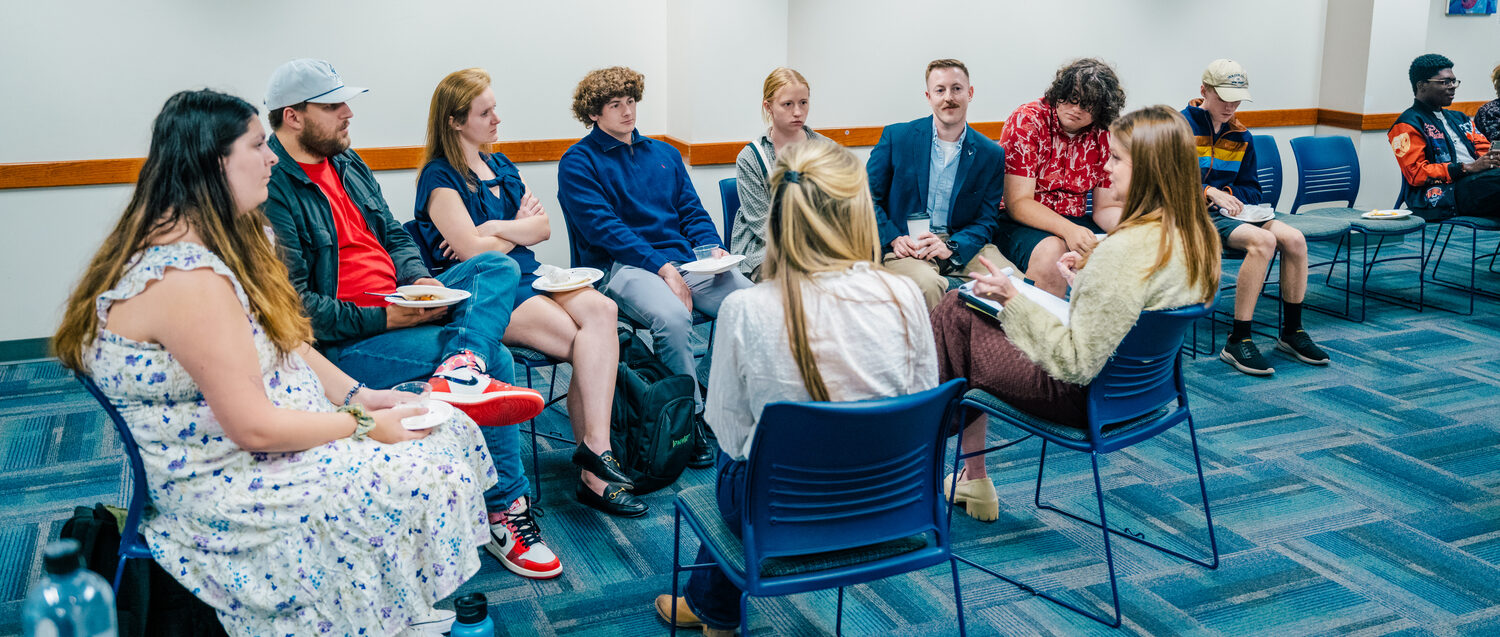 students debate in a group for political science class.