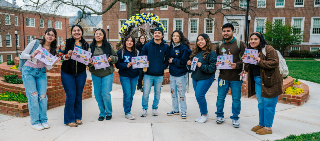 students line up in front of the Astera sculpture during their women's history scavenger hunt