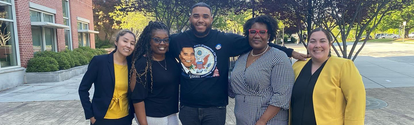 A Higher Education instructor, Dr. Delma Ramos, engages with students in the educational studies program.