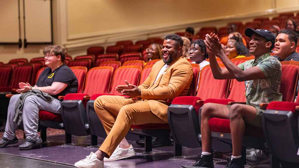 Winston Duke addresses drama students for a masterclass in the UNCG auditorium.